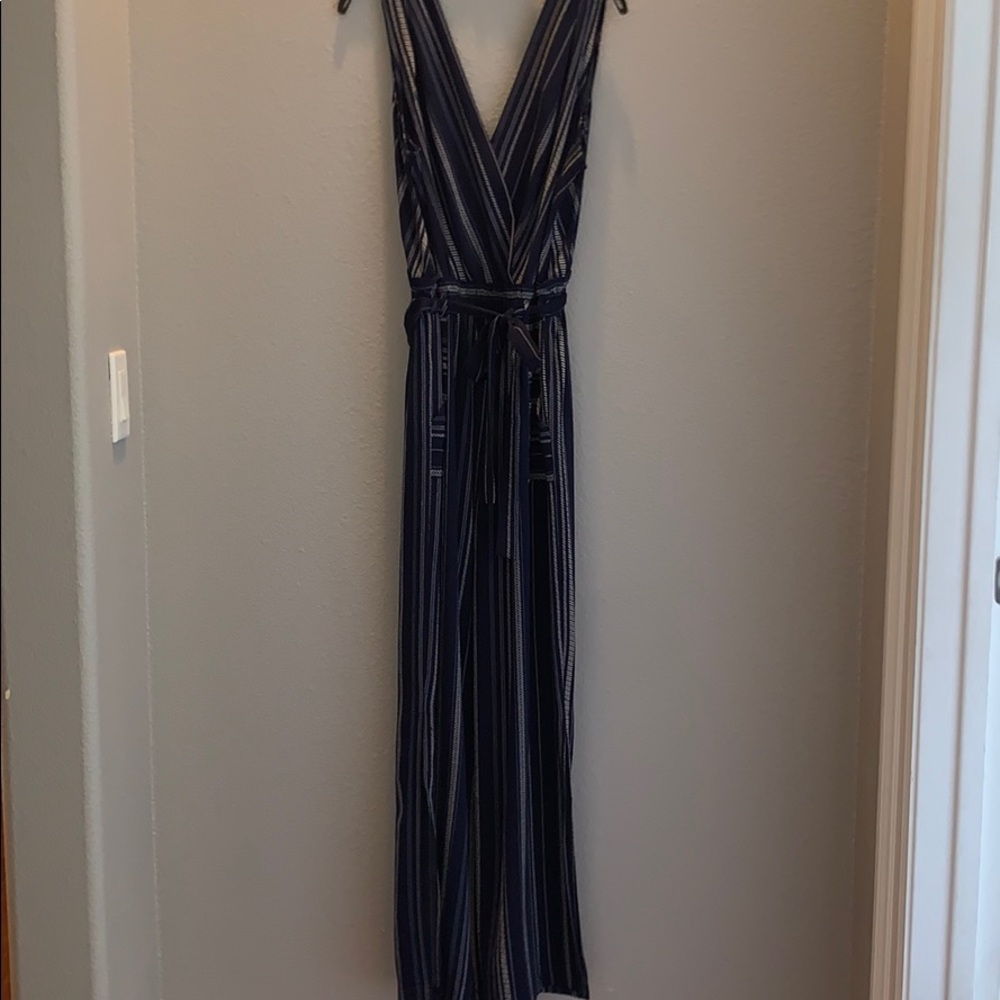 navy and white jumpsuit with pockets